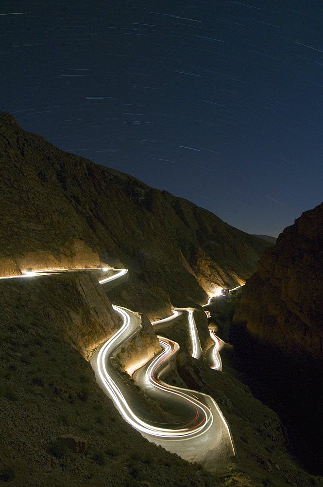 car light trails at night, winding curved mountain road, Dades, Gorge,  Morocco, North Africa