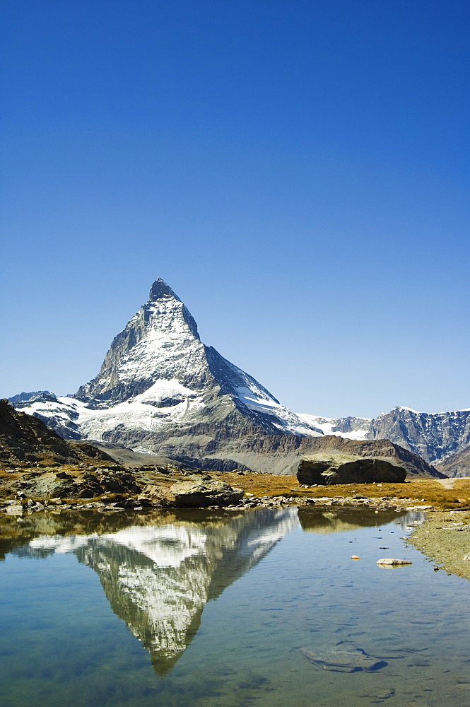 Reflection in small lake of the Matterhorn, 4477m, Zermatt Alpine Resort, Valais, Switzerland, Europe