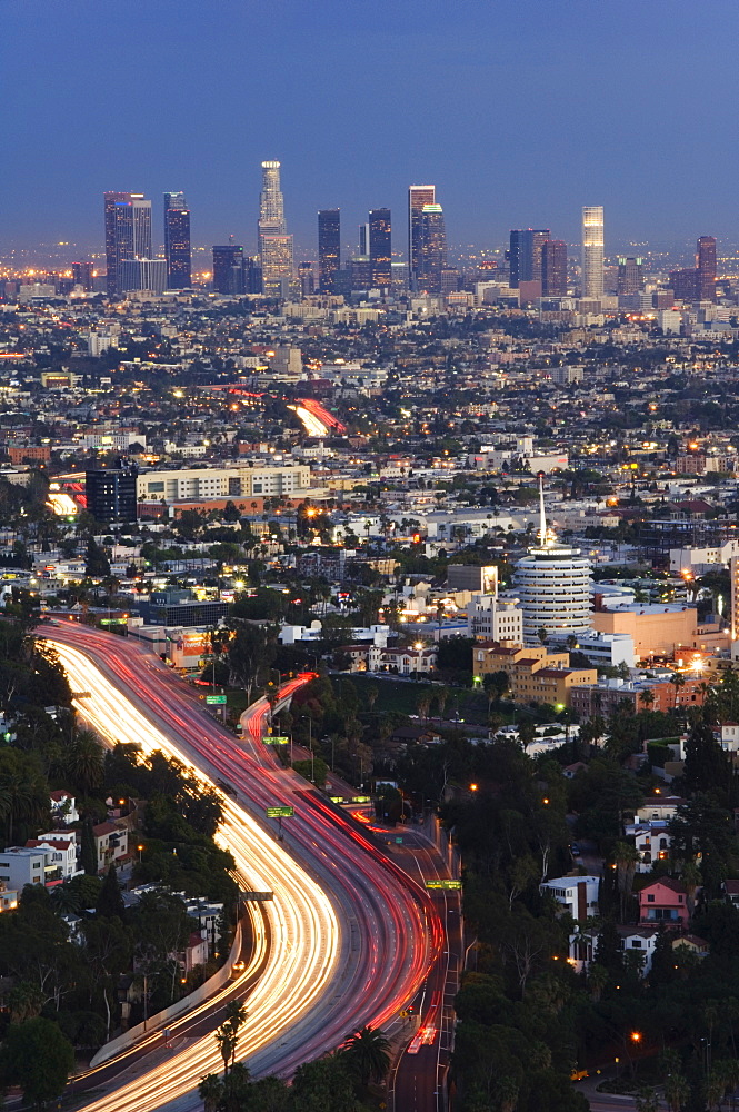 Downtown district skyscrapers and car lights on a city highway, Los Angeles, California, United States of America, North America