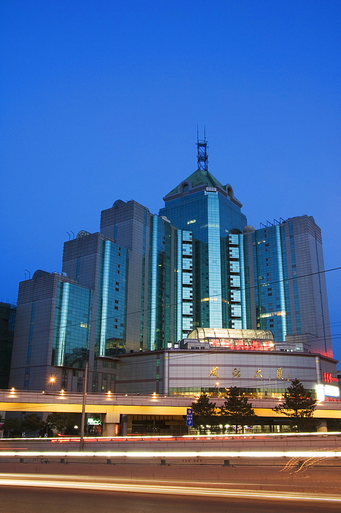 Car light trails and modern buildings near Beijing North Train Station, Xizhimen district, Beijing, China, Asia