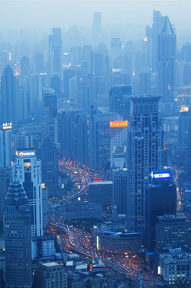 Car light trails and illuminated buildings leading from the Bund, Shanghai, China, Asia