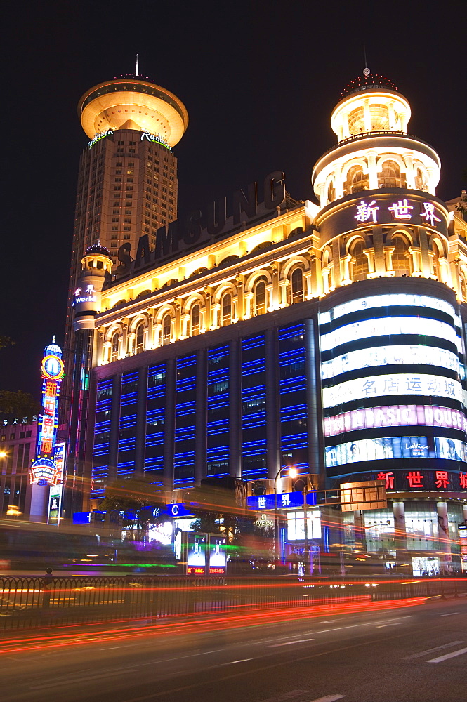 Car light trails and illuminated buildings, Peoples Square, Shanghai, China, Asia