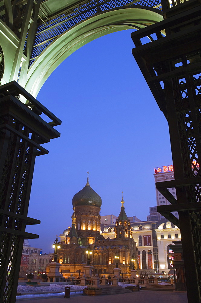 St. Sophia Russian Orthodox Church seen through arches illuminated at night, built in 1907 in the Daoliqu area, Harbin, Heilongjiang Province, Northeast China, China, Asia