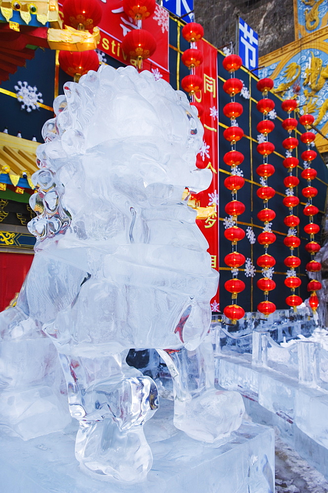 A lion statue ice sculpture at Longqing Gorge Ice sculpture festival, Beijing, China, Asia