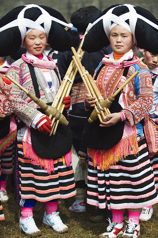 Long Horn Miao women at lunar New Year festival celebrations in Sugao ethnic village, Guizhou Province, China, Asia