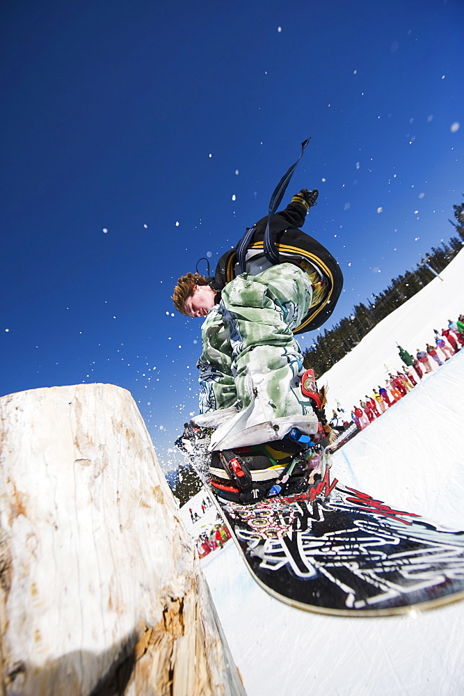 A snowboarder jumping at Telus Half Pipe competition 2009, Whistler mountain, 2010 Winter Olympics venue, British Columbia, Canada, North America