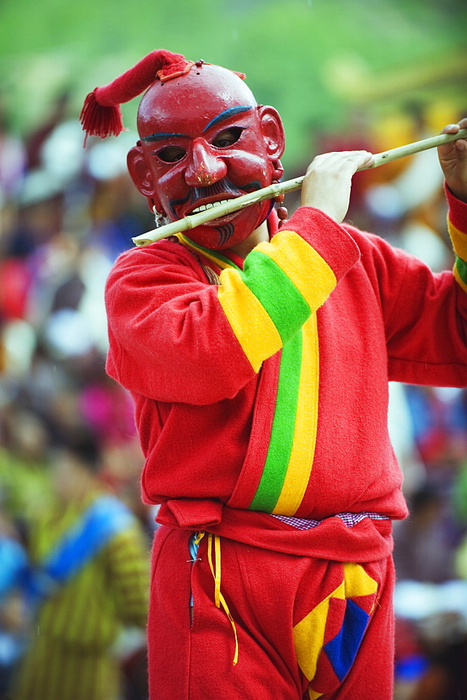 Flute playing dancer, Autumn Tsechu (festival) at Trashi Chhoe Dzong, Thimpu, Bhutan, Asia