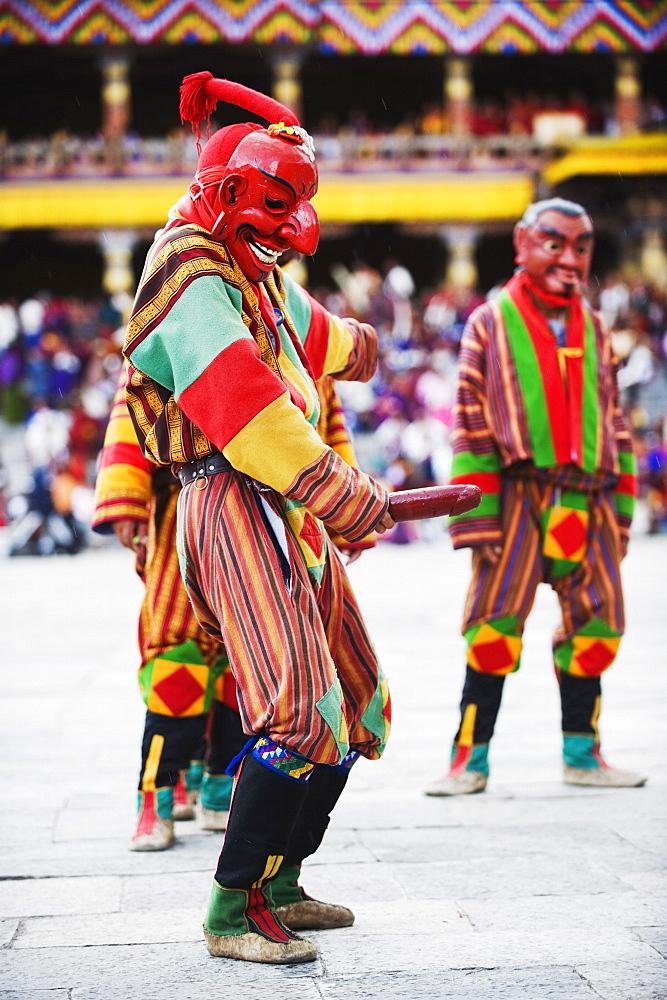 Dancer holding wooden penis, Autumn Tsechu (festival) at Trashi Chhoe Dzong, Thimpu, Bhutan, Asia