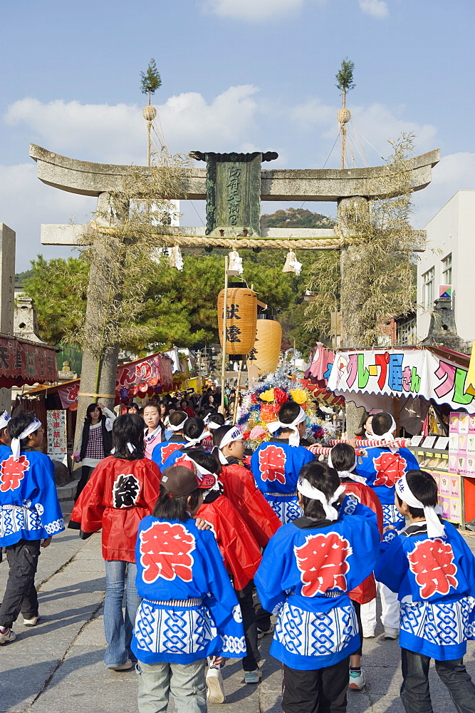 Festival goers at a torii gate at Hadaka matsuri (Naked Festival), Hofu city, Yamaguchi Prefecture, Japan, Asia