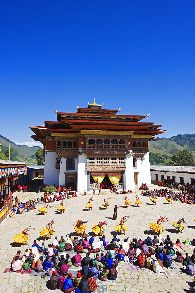 Dancers in costume at Tsechu (festival), Gangtey Gompa (Monastery), Phobjikha Valley, Bhutan, Asia