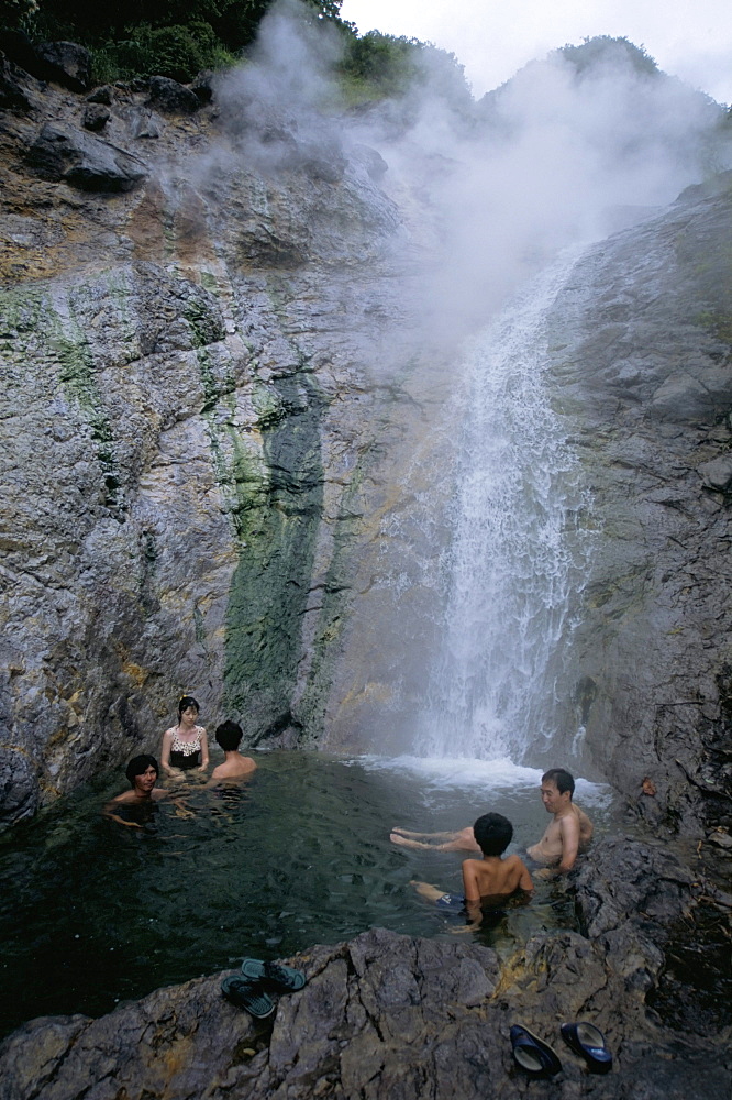 Relaxing in volcanic hot water waterfall, Kamuiwakka-no-taki falls, Shiretoko National Park, Hokkaido, Japan, Asia