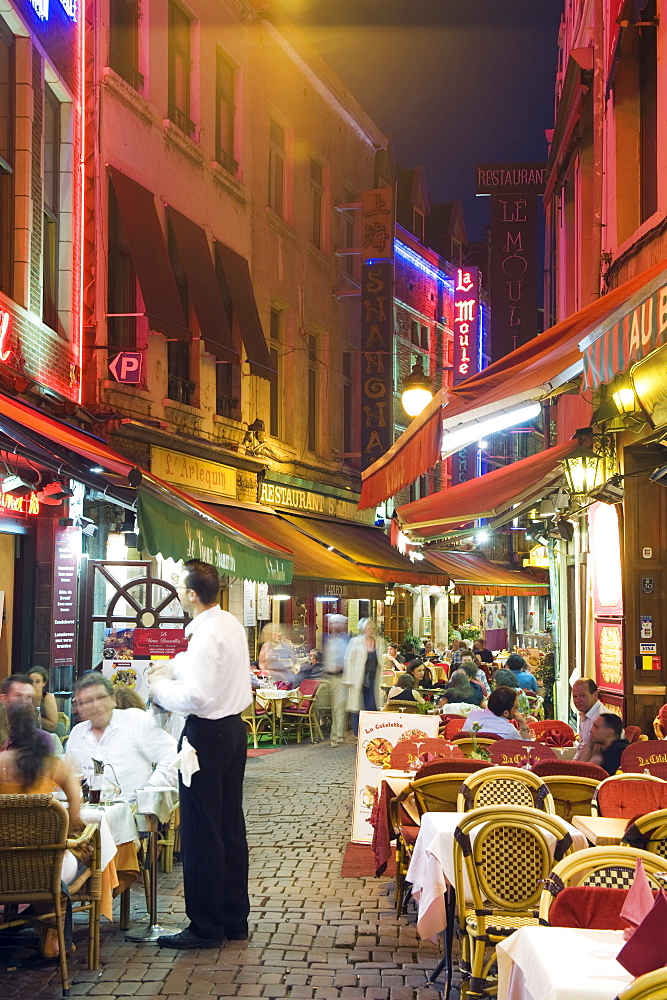 Outdoor dining in narrow street of restaurants, Brussels, Belgium, Europe