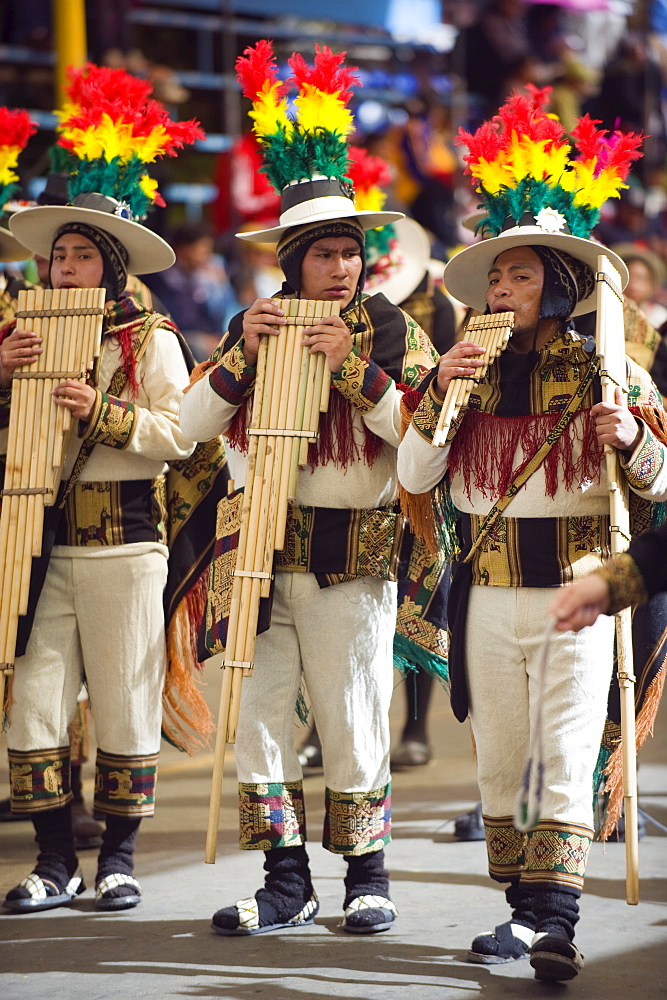 Musicians playing the flute during Oruro Carnival, Oruro, Bolivia, South America