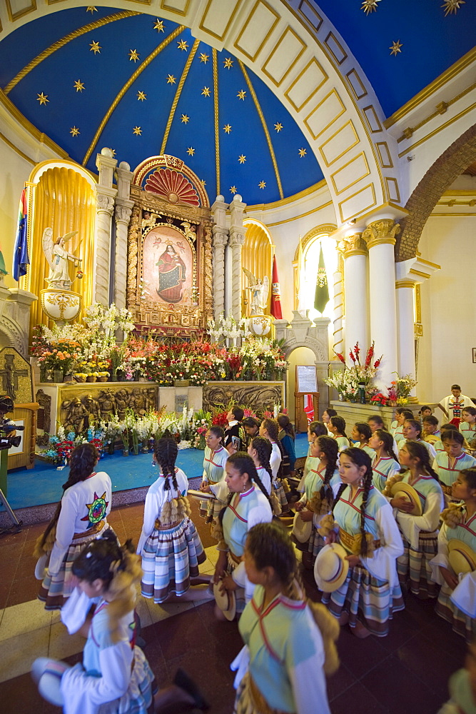 Procession continuing inside church at the Oruro Carnival, Oruro, Bolivia, South America