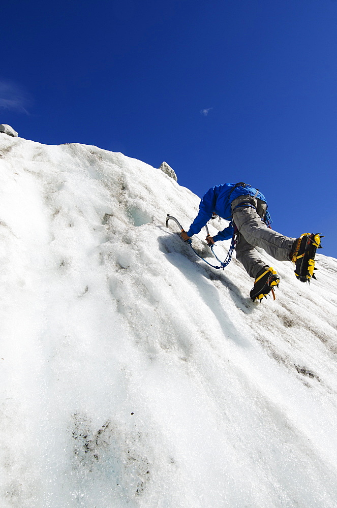 Ice climber at Mer de Glace glacier, Chamonix, Haute-Savoie, French Alps, France, Europe