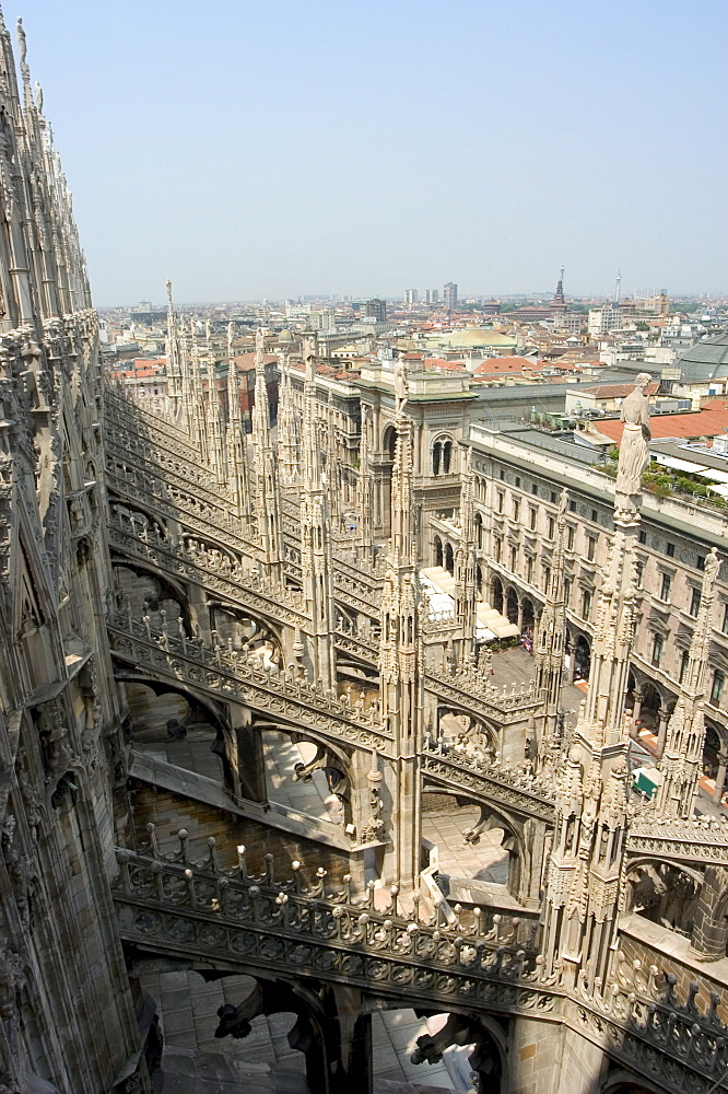 Rooftop spires of Duomo Cathedral and city, Milan, Lombardy, Italy, Europe