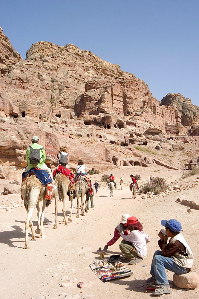 Tourist on camels in Petra, UNESCO World Heritage Site, Wadi Musa (Mousa), Jordan, Middle East