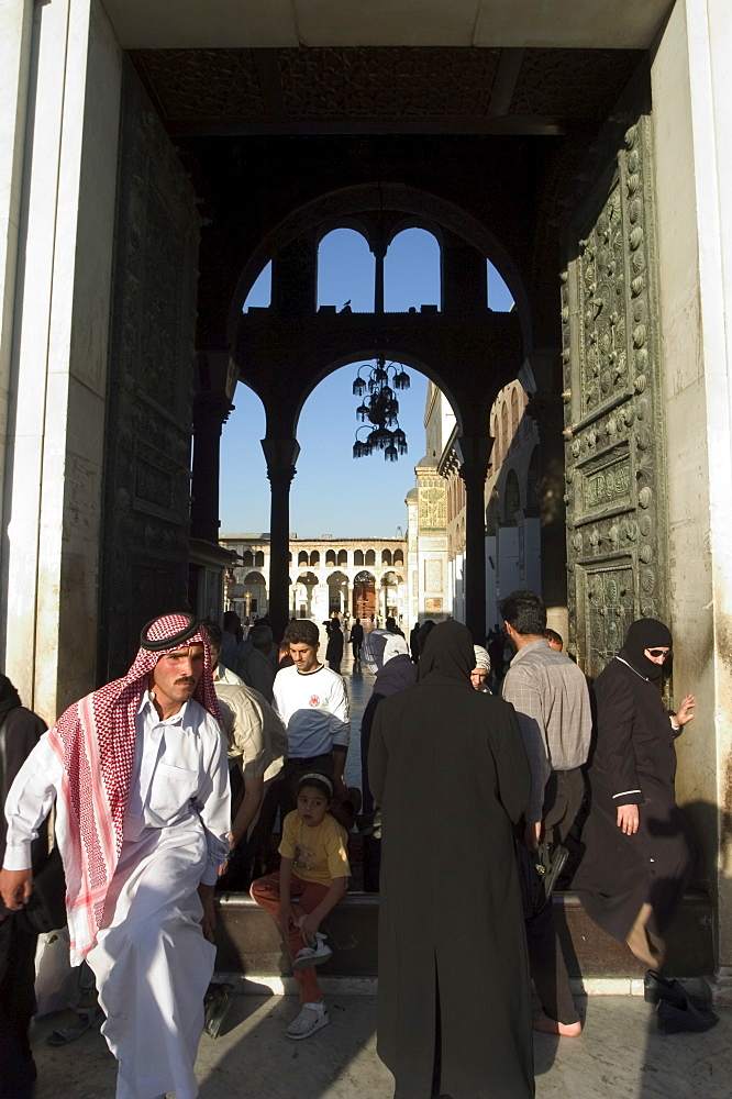 People walking in and out of Umayyad Mosque, Damascus, Syria, Middle East