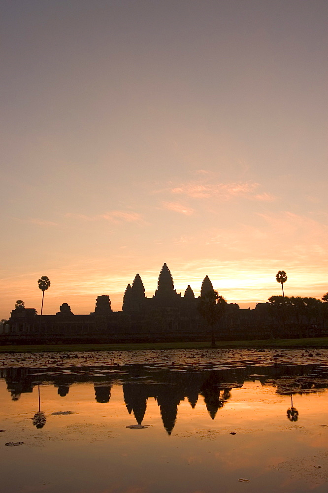 Sunrise, Angkor Wat Temple and reflection in water, UNESCO World Heritage Site, Siem Reap, Cambodia, Southeast Asia, Asia