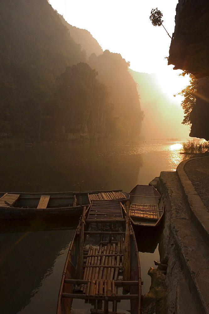 Boats at sunrise, limestone mountain scenery, Tam Coc, Ninh Binh, south of Hanoi, North Vietnam, Southeast Asia, Asia