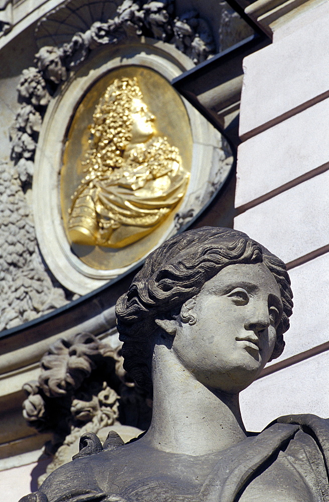 Close-up of the head of a female statue and frieze behind at Zeughaus, Mitte, Berlin, Germany, Europe