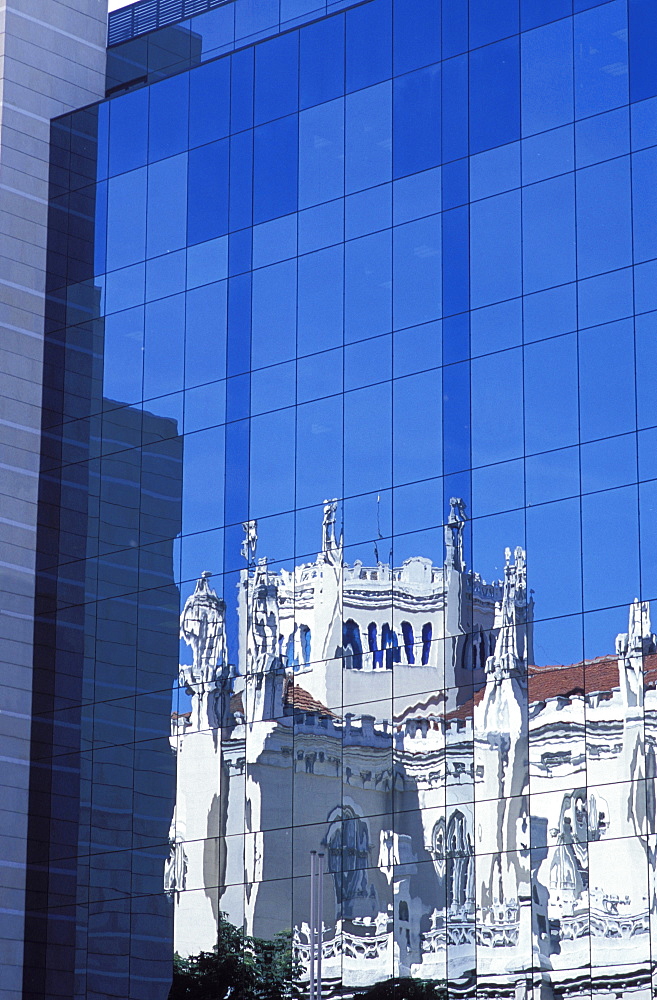 Reflection of Iglesia Notre Sra de la Concepcion (Church of our Lady of the Conception) in modern building, Calle de Serrano, Salamanca, Madrid, Spain, Europe