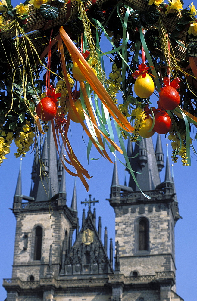 Easter gate decoration hanging from the Easter gate on Old Town Square, with Tyn church towers in the background, Old Town, UNESCO World Heritage Site, Prague, Czech Republic, Europe