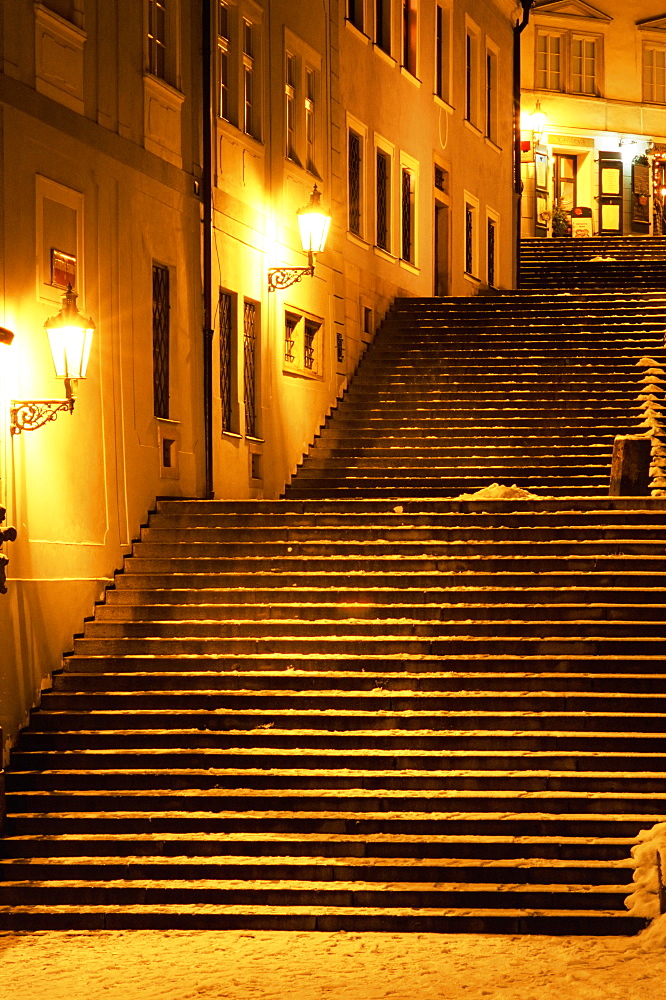 Snow covered Radnicke Steps in Mala Strana suburb at night, Prague, Czech Republic, Europe