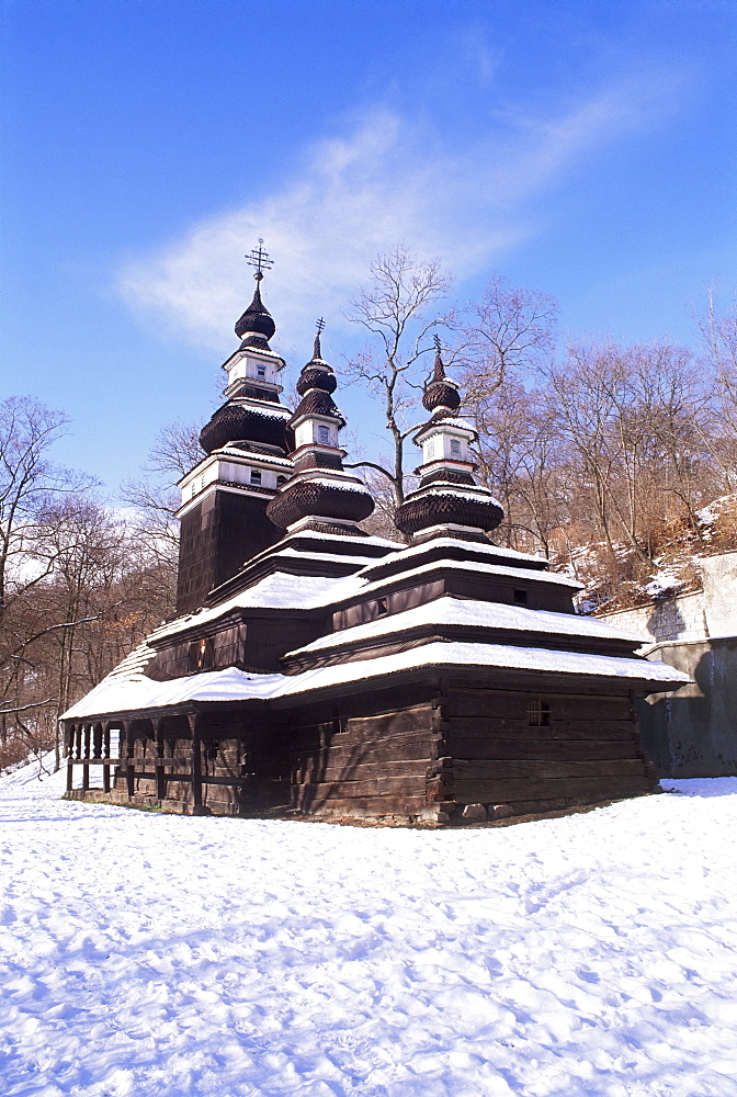 Snow-coverd Christian Orthodox wooden church of St. Michael dating from the 18th century, transferred to present site from western Ukraine village of Medvedov, Smichov, Prague, Czech Republic, Europe