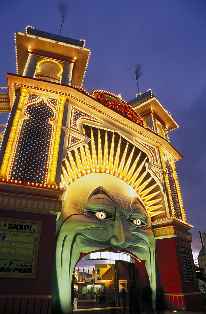 Exterior of Luna Park entrance illuminated at twilight, St. Kilda, Melbourne, Victoria, Australia, Pacific