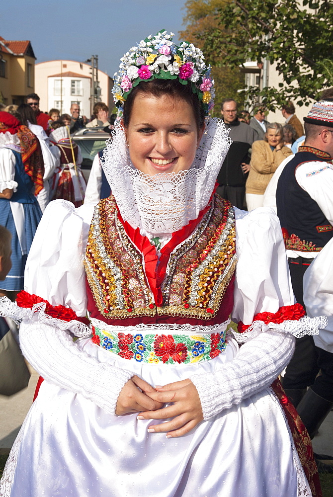 Woman wearing folk dress during autumn Feast with Law Festival, Moravian Slovacko village of Zdanice, Brnensko, Czech Republic, Europe