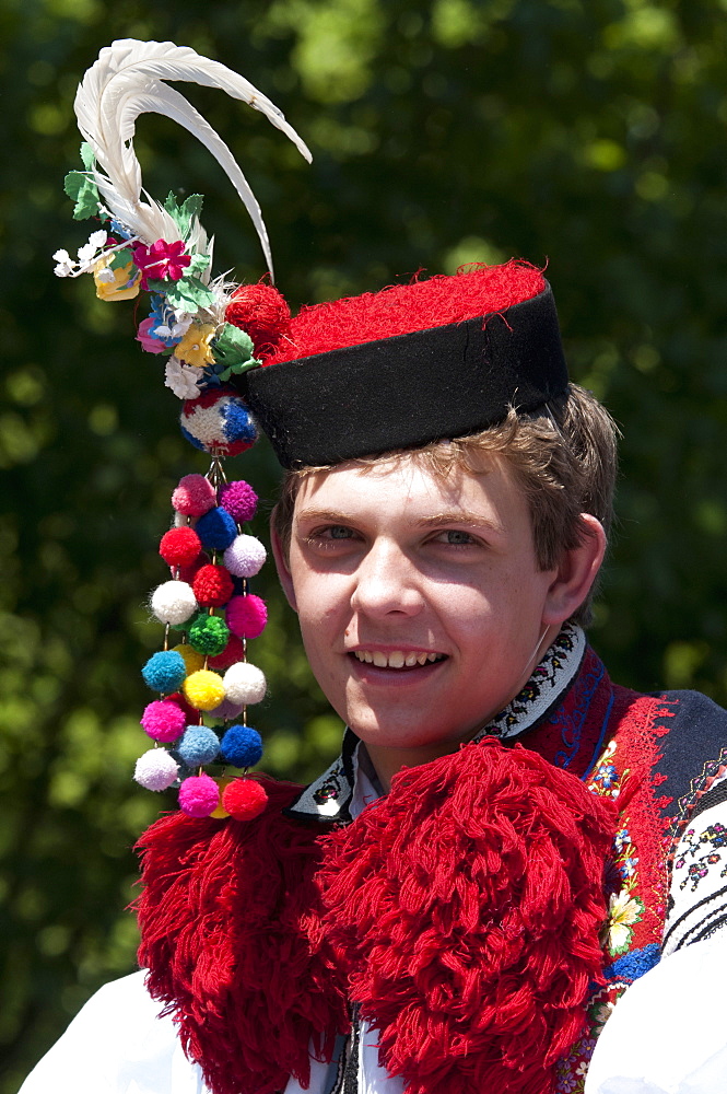 Young man wearing folk dress during festival The Ride of the Kings, Vlcnov, Zlinsko, Czech Republic, Europe