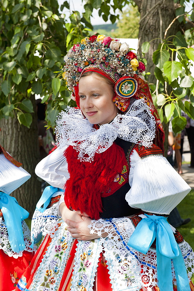 Woman wearing Vlcnov folk dress during The Ride of the Kings festival, Vlcnov, Zlinsko, Czech Republic, Europe