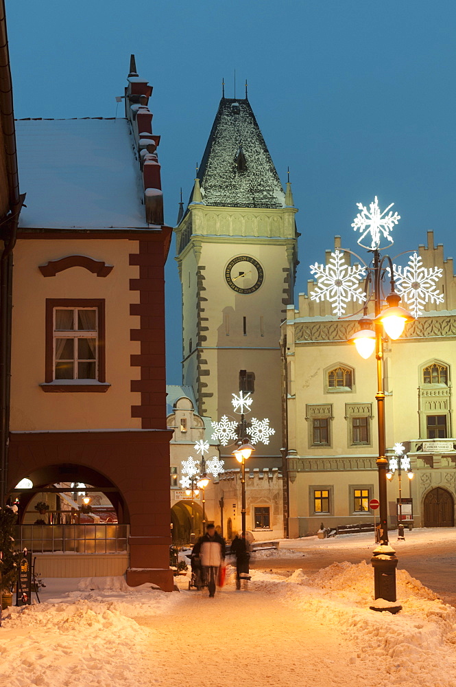 Snow-covered Christmas decorated lamps and Gothic Town Hall, Tabor, Jihocesky, Czech Republic, Europe 