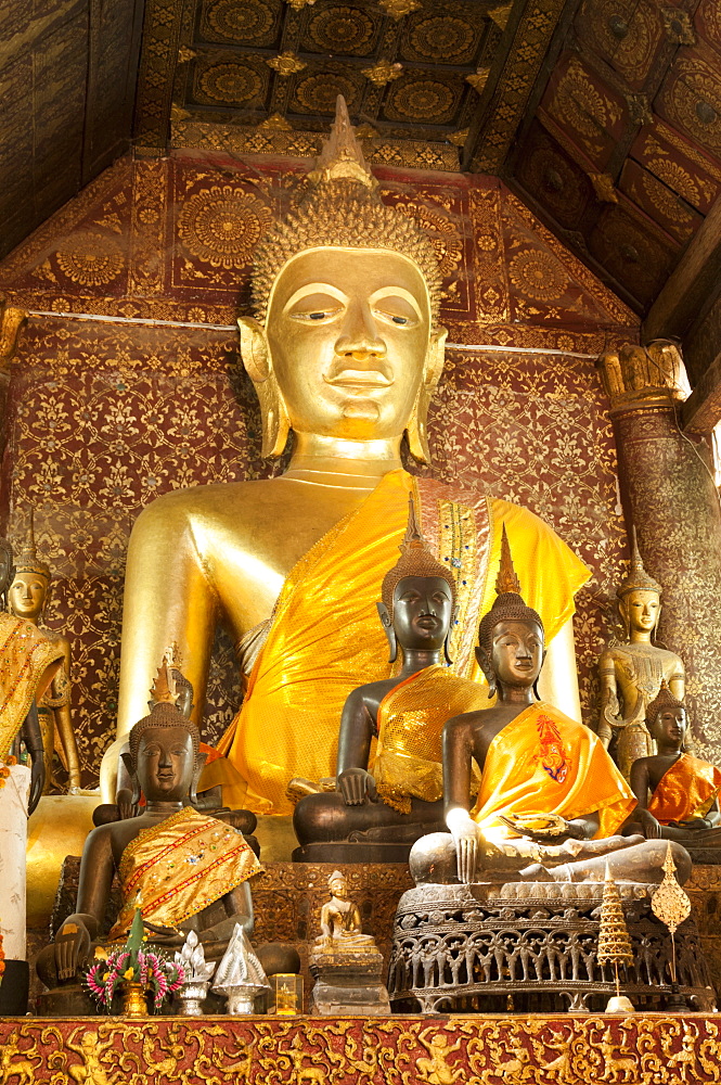 Various statues of Budhhas around altar inside Temple Wat Xiengmouane Vajiramangalaram, Luang Prabang, Laos, Indochina, Southeast Asia, Asia