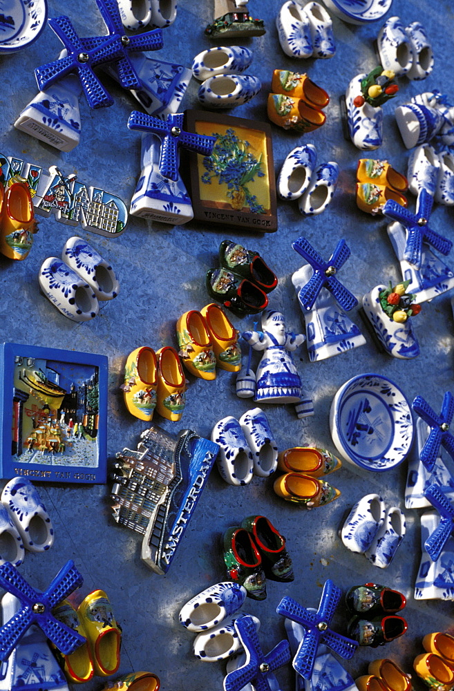 Overhead view of ceramic magnet souvenirs of clogs and windmills for sale, Amsterdam The Netherlands (Holland), Europe