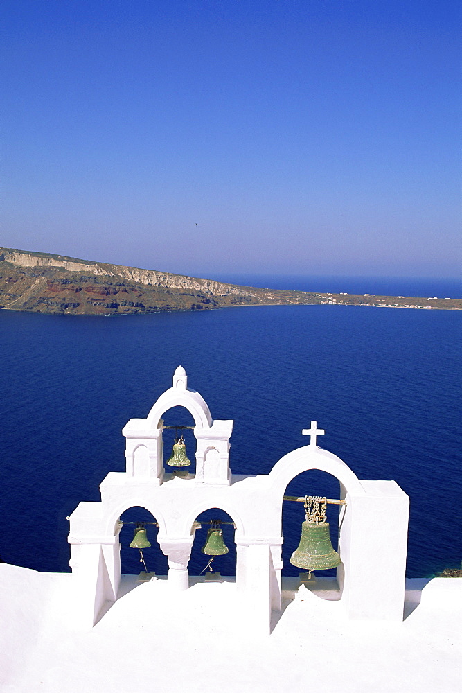 Bell tower on Christian church, Oia (Ia), Santorini (Thira), Cyclades Islands, Aegean Sea, Greece, Europe