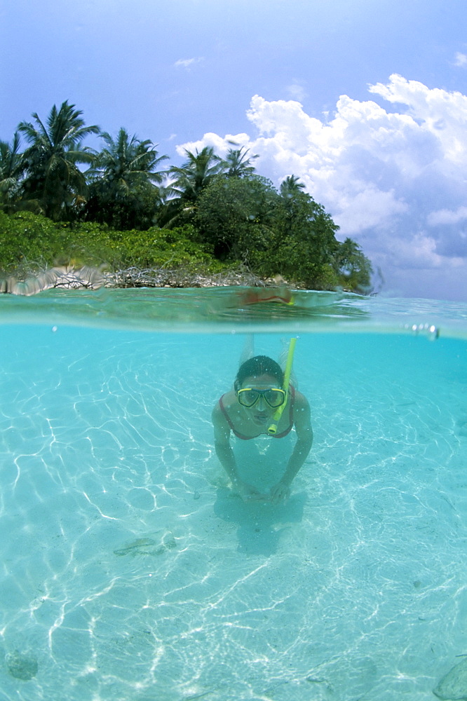 Woman snorkelling, North Male Atoll, Maldives, Indian Ocean, Asia