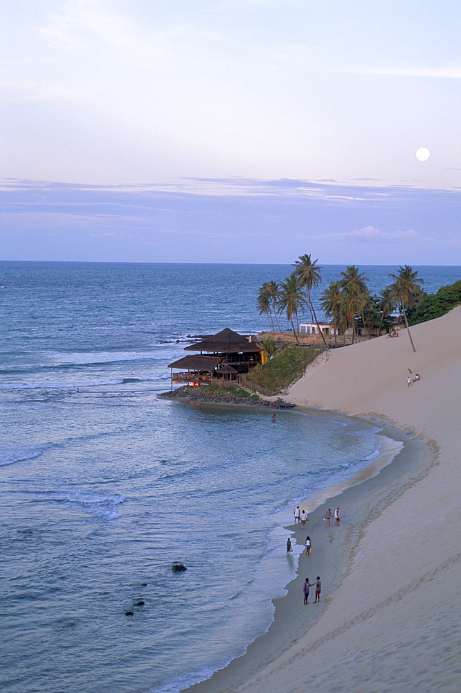 Beach, dunes and Bar 21 at dusk, Genipabu, Natal, Rio Grande do Norte state, Brazil, South America