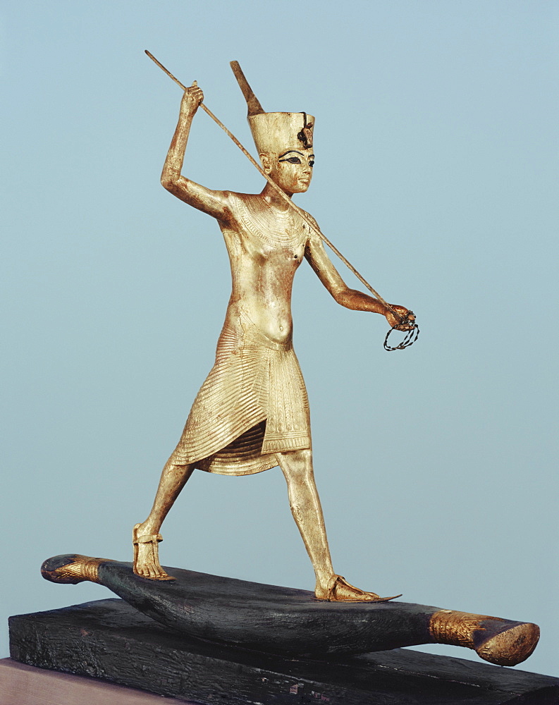 Gilt wood statuette of Tutankhamun on a boat with a harpoon, from the tomb of the pharaoh Tutankhamun, discovered in the Valley of the Kings, Thebes, Egypt, North Africa, Africa