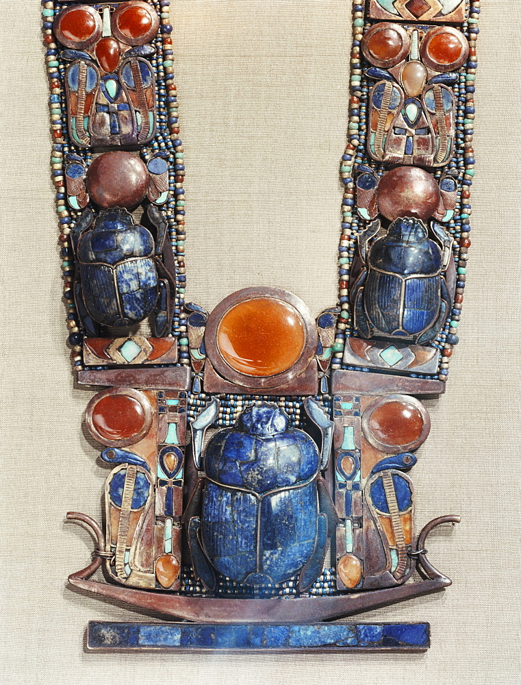 Pendant in the form of a boat showing a scarab, the symbol of the god's resurrection, flanked by two royal serpents, from the tomb of the pharaoh Tutankhamun, discovered in the Valley of the Kings, Thebes, Egypt, North Africa, Africa