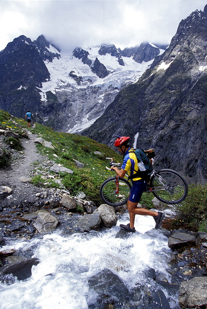 On bike on Gran Balconata, towards Bonatti alpine refuge, Ferret Valley, Valle d'Aosta, Italy