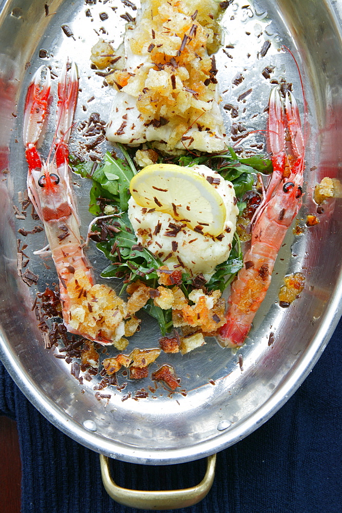 Cod fish and prawn au gratin with truffle on lemon cream, Orestorante restaurant, Ponza island, Lazio, Italy 