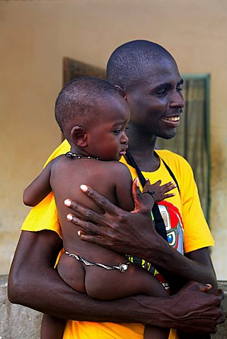 Man with child, M'Bour, Republic of Senegal, Africa
