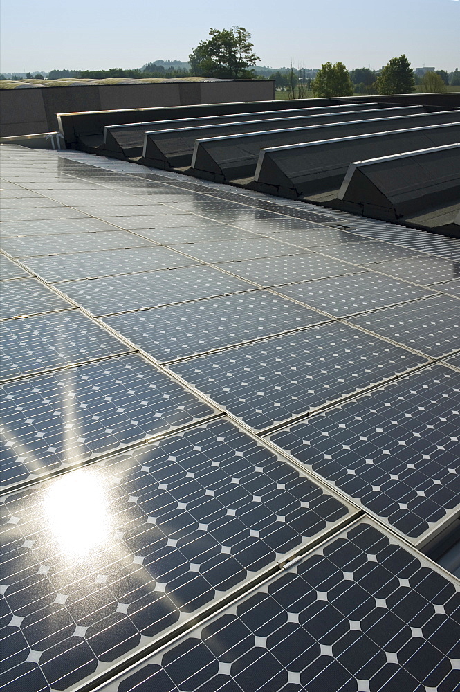 solar power system on factory, azzano san paolo, italy