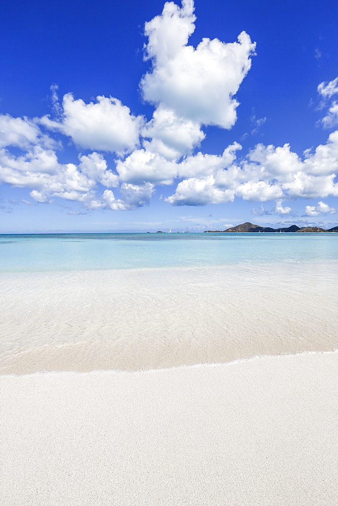 Blue sky frames the white sand and the turquoise Caribbean Sea, Ffryers Beach, Antigua and Barbuda, Leeward Islands, West Indies