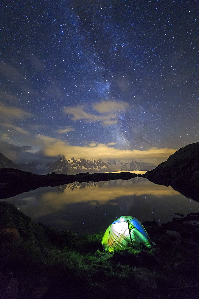 Camping under the stars and Milky Way on the shores of Lac de Cheserys Chamonix, Haute Savoie, France, Europe