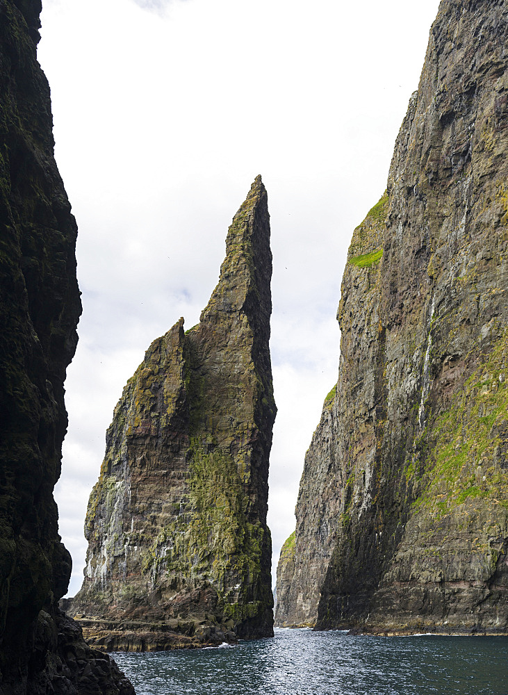 The cliffs, sea stacks and arches at Vestmanna, one of the big attractions of the Faroe Islands  The island Streymoy, one of the two large islands of the Faroe Islands  in the North Atlantic.  Europe, Northern Europe, Denmark, Faroe Islands