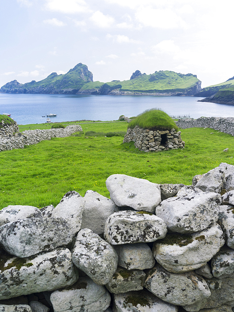 The islands of St Kilda archipelago in Scotland. Island of Hirta , Traditonal Cleit, a dry stone bothy used for storing food and other materials. It is one of the few places worldwide to hold joint UNESCO world heritage status for its natural and cultural qualities. Europe, Scotland, St. Kilda, July