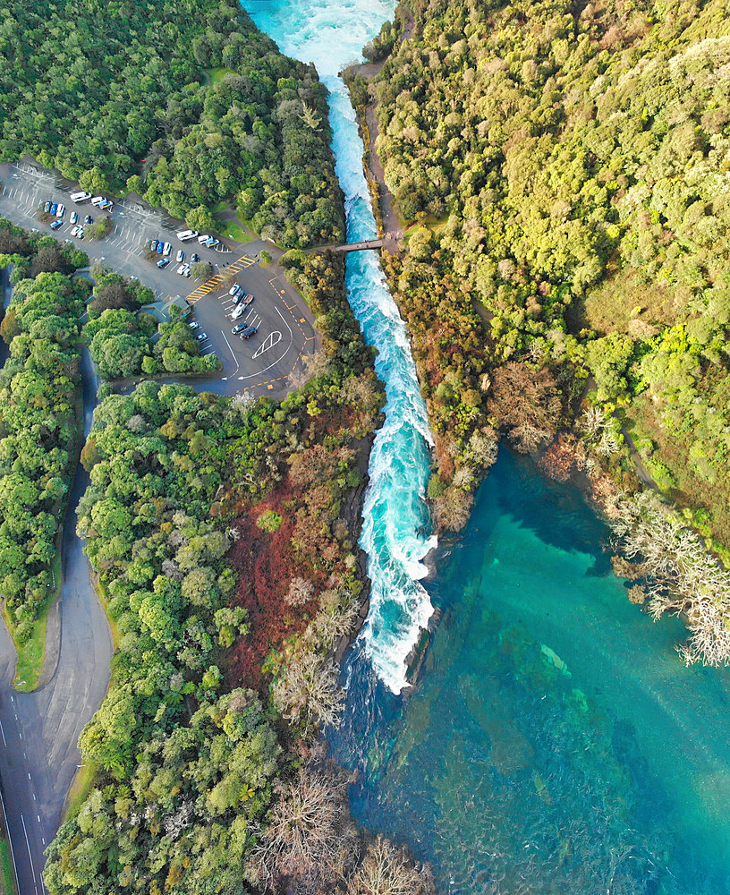 Huka Falls, New Zealand. Panoramic aerial view of beautiful waterfalls and countryside at sunset.